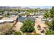 Aerial view of a home's backyard featuring a large tree and spacious area with mountain views in the distance at 4305 E Cherokee St, Phoenix, AZ 85044