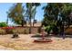 Backyard featuring a fountain, seating area, and green foliage at 4305 E Cherokee St, Phoenix, AZ 85044