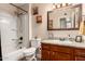 Cozy bathroom with a shower-tub, vanity, and neutral decor at 4305 E Cherokee St, Phoenix, AZ 85044