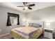 Comfortable bedroom with ceiling fan, natural light, and neutral wall color at 4305 E Cherokee St, Phoenix, AZ 85044