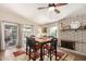 Dining area with black and wood table set, fireplace, and sliding door access to patio at 4305 E Cherokee St, Phoenix, AZ 85044
