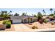 Charming single-story home boasting a well-maintained front yard with desert landscaping and a spacious driveway at 4305 E Cherokee St, Phoenix, AZ 85044
