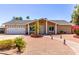 Charming single-story home with desert landscaping and brick walkway to front door at 4305 E Cherokee St, Phoenix, AZ 85044