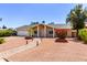 Inviting single-story home with low-maintenance desert landscaping and a brick-lined pathway at 4305 E Cherokee St, Phoenix, AZ 85044