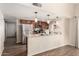 Bright kitchen featuring granite countertops, pendant lighting, and stainless steel appliances at 4305 E Cherokee St, Phoenix, AZ 85044
