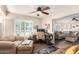 Bright living room with a workstation, wood-look floors, and comfortable seating area at 4305 E Cherokee St, Phoenix, AZ 85044