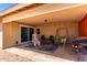 Covered patio area furnished with chairs and a grill at 4305 E Cherokee St, Phoenix, AZ 85044