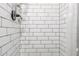 Clean and modern shower featuring white subway tile and a chrome shower head at 4305 E Cherokee St, Phoenix, AZ 85044