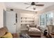 Cozy sitting room featuring a comfortable armchair, shelves, and natural light at 4305 E Cherokee St, Phoenix, AZ 85044