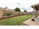 Backyard features a well-maintained lawn and block fence with planters along the perimeter at 4423 W Escuda Dr, Glendale, AZ 85308