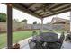 Backyard featuring a covered patio with a dining table, nice landscaping and block fence at 4423 W Escuda Dr, Glendale, AZ 85308