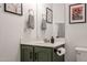 Bathroom features a custom vanity, framed art, and modern hardware and lighting at 4423 W Escuda Dr, Glendale, AZ 85308