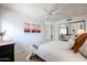 Bright bedroom featuring a large mirror door closet and desert themed decor at 4423 W Escuda Dr, Glendale, AZ 85308