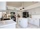 Bright kitchen with ample counter space, a center island, black appliances, and modern fixtures for cooking at 4423 W Escuda Dr, Glendale, AZ 85308