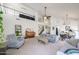 Bright living room featuring high ceilings, a fireplace, and lots of natural light at 4423 W Escuda Dr, Glendale, AZ 85308