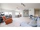 Bright living area featuring vaulted ceilings, a cozy recliner, and lots of open space at 4423 W Escuda Dr, Glendale, AZ 85308