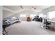 Spacious living room with high ceilings, natural light, and comfortable seating arrangement at 4423 W Escuda Dr, Glendale, AZ 85308