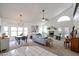 Bright living room featuring high ceilings, a fireplace, and lots of natural light at 4423 W Escuda Dr, Glendale, AZ 85308