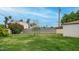 Back yard with a section of green grass and various trees and bushes around at 4630 N 12Th Pl, Phoenix, AZ 85014