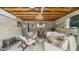 Finished basement offers a casual living space with exposed beams, a bar area, and comfortable seating at 4630 N 12Th Pl, Phoenix, AZ 85014