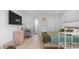 Bright bedroom with a bed, workspace, wood floors, and convenient amenities for a comfortable stay at 4630 N 12Th Pl, Phoenix, AZ 85014