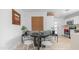Cozy dining area features a round table with white chairs, complemented by stylish decor and ample natural light at 4630 N 12Th Pl, Phoenix, AZ 85014