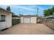 Back yard featuring a stand alone garage, concrete patio, and small side yard at 4630 N 12Th Pl, Phoenix, AZ 85014