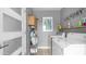 Well-lit laundry room with modern washer and dryer and storage shelves at 4630 N 12Th Pl, Phoenix, AZ 85014