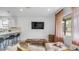 Cozy living room with neutral decor, modern lighting, a stylish coffee table, and a view to the kitchen at 4630 N 12Th Pl, Phoenix, AZ 85014