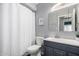 Bathroom showcases modern vanity, framed mirror, and shower with decorative curtain at 4810 W Kelton Ln, Glendale, AZ 85306