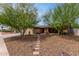 Inviting home with desert landscaping, stepping stone pathway, and mature shade trees at 4810 W Kelton Ln, Glendale, AZ 85306