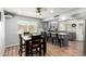 Bright eat-in kitchen features gray cabinetry, modern appliances, and wood-look flooring at 4810 W Kelton Ln, Glendale, AZ 85306