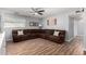 Comfortable living room featuring a sectional sofa and wood flooring at 4810 W Kelton Ln, Glendale, AZ 85306