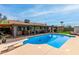 Backyard features a sparkling pool, covered patio, and ample space for outdoor enjoyment and entertainment at 4810 W Kelton Ln, Glendale, AZ 85306