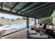 Inviting covered outdoor area with pool, seating, and patio furniture, perfect for entertaining and relaxation at 4810 W Kelton Ln, Glendale, AZ 85306
