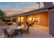 Backyard patio featuring a fire pit and seating area, perfect for enjoying the evening with friends and Gathering at 6339 S Palo Blanco Dr, Gold Canyon, AZ 85118