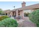 Backyard with a covered patio and views of the lush landscaping and golf course at 6339 S Palo Blanco Dr, Gold Canyon, AZ 85118