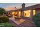Spacious backyard with a covered patio, outdoor seating and lush greenery, ideal for outdoor entertaining at 6339 S Palo Blanco Dr, Gold Canyon, AZ 85118