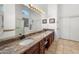 Bright bathroom featuring a double vanity, granite countertops and a full mirror at 6339 S Palo Blanco Dr, Gold Canyon, AZ 85118