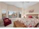 Bright bedroom with vaulted ceilings, natural light from bay windows, and a cozy sitting area at 6339 S Palo Blanco Dr, Gold Canyon, AZ 85118