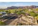 Aerial view of Fountain Brook Village entrance sign and surrounding community landscape at 6339 S Palo Blanco Dr, Gold Canyon, AZ 85118