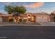 Attractive single-story home featuring mature desert landscaping, a two-car garage and tiled roof at 6339 S Palo Blanco Dr, Gold Canyon, AZ 85118
