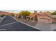 Beautiful desert home showcasing manicured landscaping, a spacious driveway, and convenient two-car garage at 6339 S Palo Blanco Dr, Gold Canyon, AZ 85118