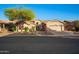 Charming single-Gathering home with a well-manicured front yard, desert landscaping, and attached two-car garage at 6339 S Palo Blanco Dr, Gold Canyon, AZ 85118