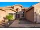 Inviting front entrance with a stone pathway, desert landscaping and a charming front door at 6339 S Palo Blanco Dr, Gold Canyon, AZ 85118