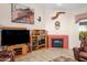 Living room featuring a fireplace, entertainment center, and comfortable seating at 6339 S Palo Blanco Dr, Gold Canyon, AZ 85118