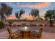 Inviting patio with a cozy fire pit and comfortable seating, perfect for enjoying the sunset views at 6339 S Palo Blanco Dr, Gold Canyon, AZ 85118