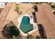 Overhead shot of backyard pool with diving board and seating area at 6428 E Shea Blvd, Scottsdale, AZ 85254