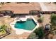 Backyard oasis featuring a large pool, covered patio, and lush landscaping at 6428 E Shea Blvd, Scottsdale, AZ 85254