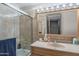 Bathroom includes vanity, shower/tub, tile, and ample lighting at 6428 E Shea Blvd, Scottsdale, AZ 85254